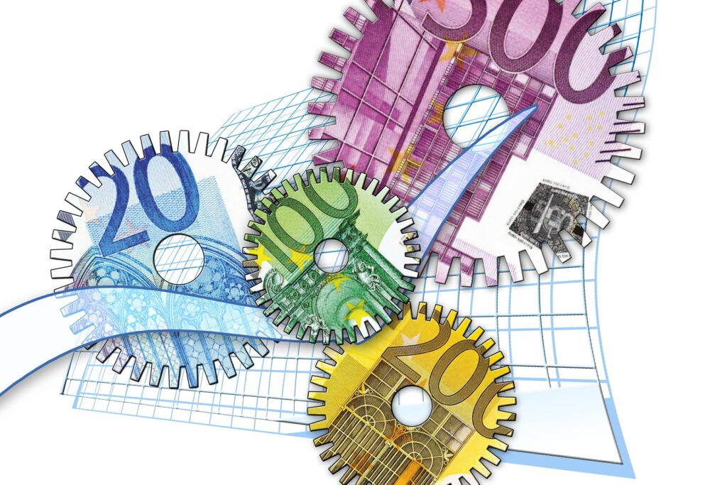 Vier tandwielen met briefgeld